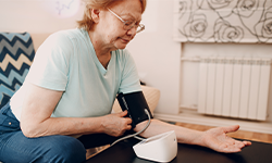 woman taking her blood pressure