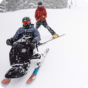 Bob Wassom riding in a ski chair