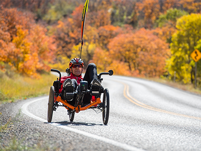 bob riding trike on moutain road