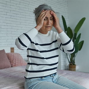 woman with hands on head