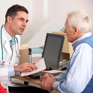 Doctor talking with an elderly man