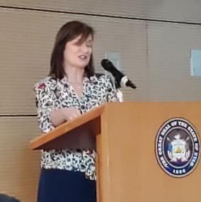 woman speaking at a podium