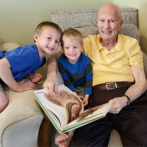 Elderly man with grandchildren