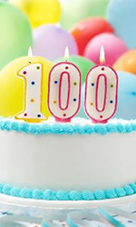 a birthday cake with number candles of the number 100