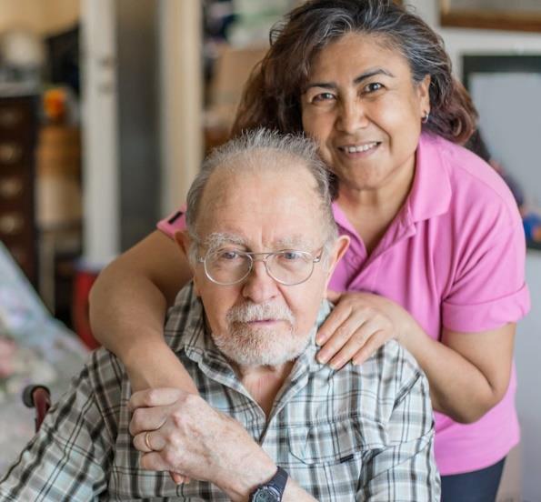 an elderly man with his caregiver