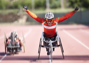 person winning race on a bike chair