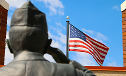 statue saluting american flag